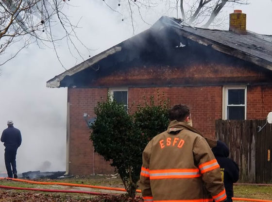 Family and dogs escape house fire