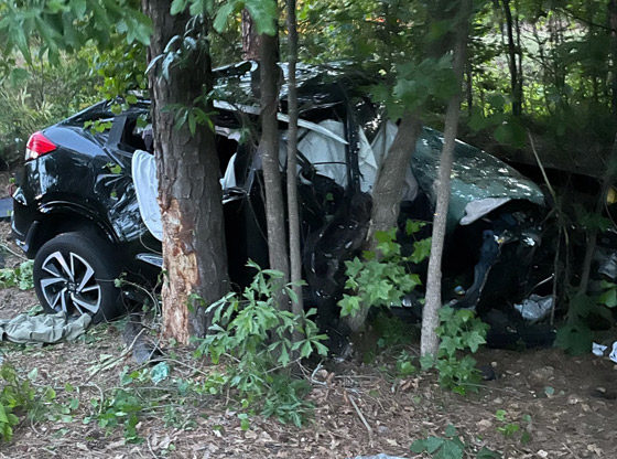 Three injured after SUV crashes down embankment