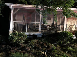 Pickup crashes into porch