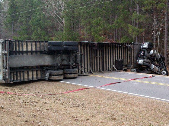 Overturned semi-truck sends one to hospital