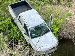 Man charged with DWI after crashing into creek