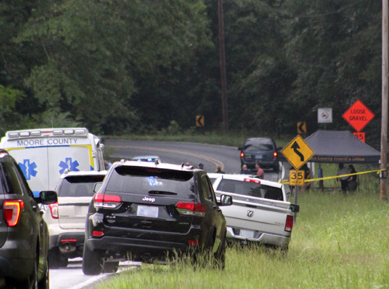 Suspects arrested after body found side of road