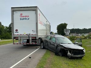 Car crashes into Chick-fil-A truck causing highway closure