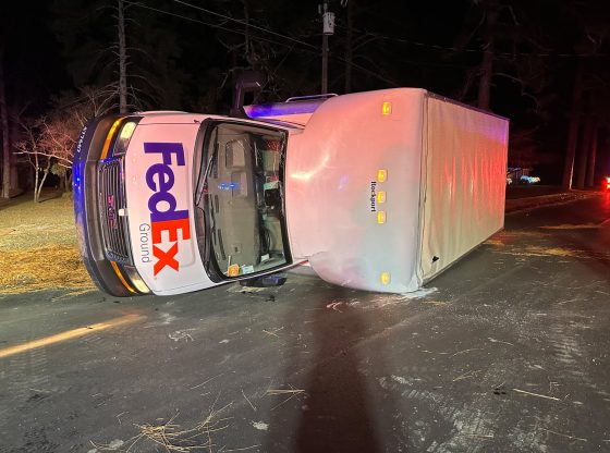 Crash with gas truck leaves FedEx truck overturned