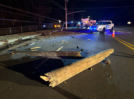 Rollover crash leaves power pole snapped in half 