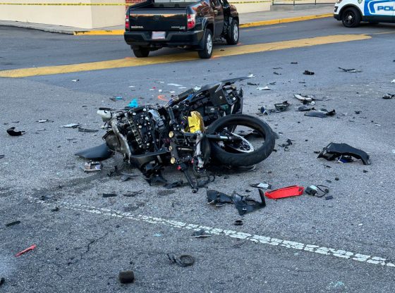 Man critical after motorcycle crashes into truck