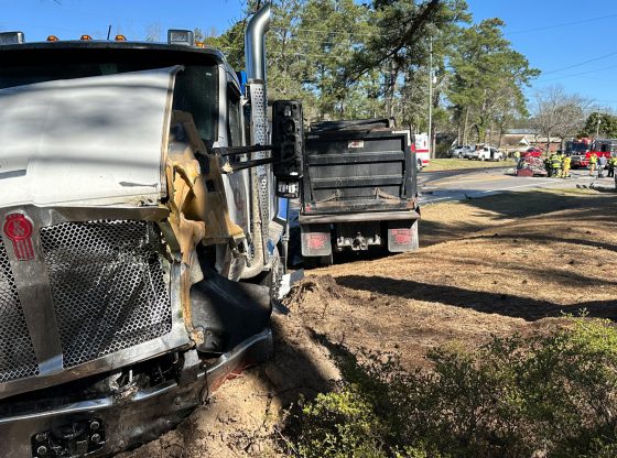 One killed in head-on crash involving a dump truck