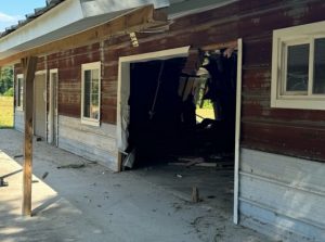 Car crashes through building outside Vass