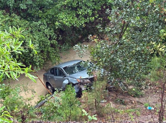 Car crashes into ravine during Helene