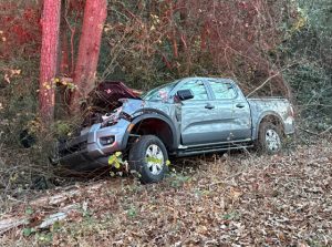 Driver receives minor injuries after truck flips in Lobelia NC