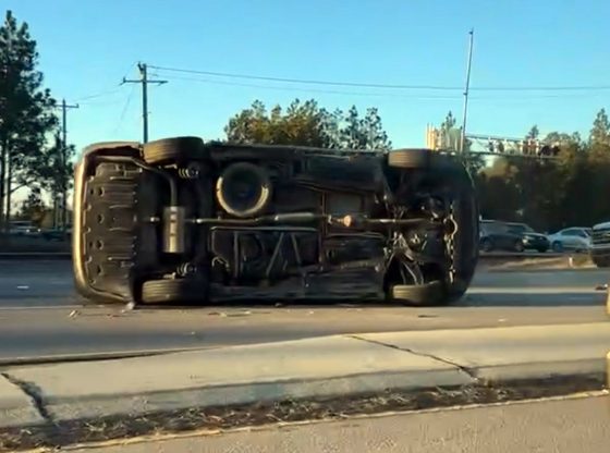 Car flips causing traffic delays