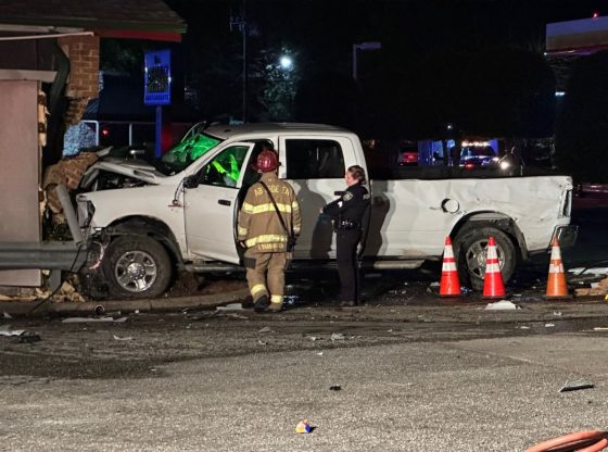 Power outages reported after truck strikes utility pole, building