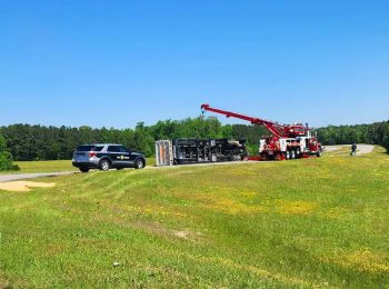 Highway ramp closes after sand truck overturns