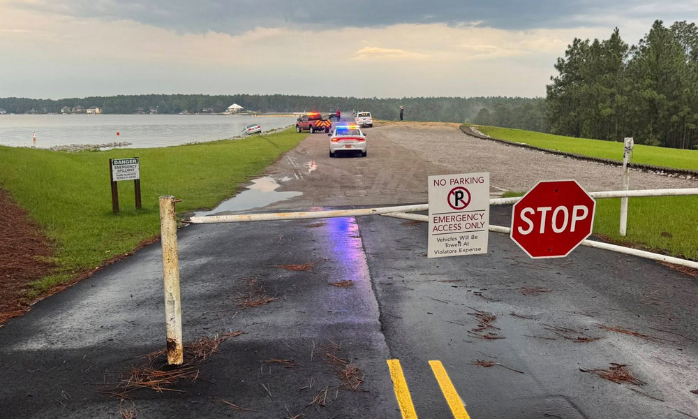 Medical emergency leads to car partially crashing into lake