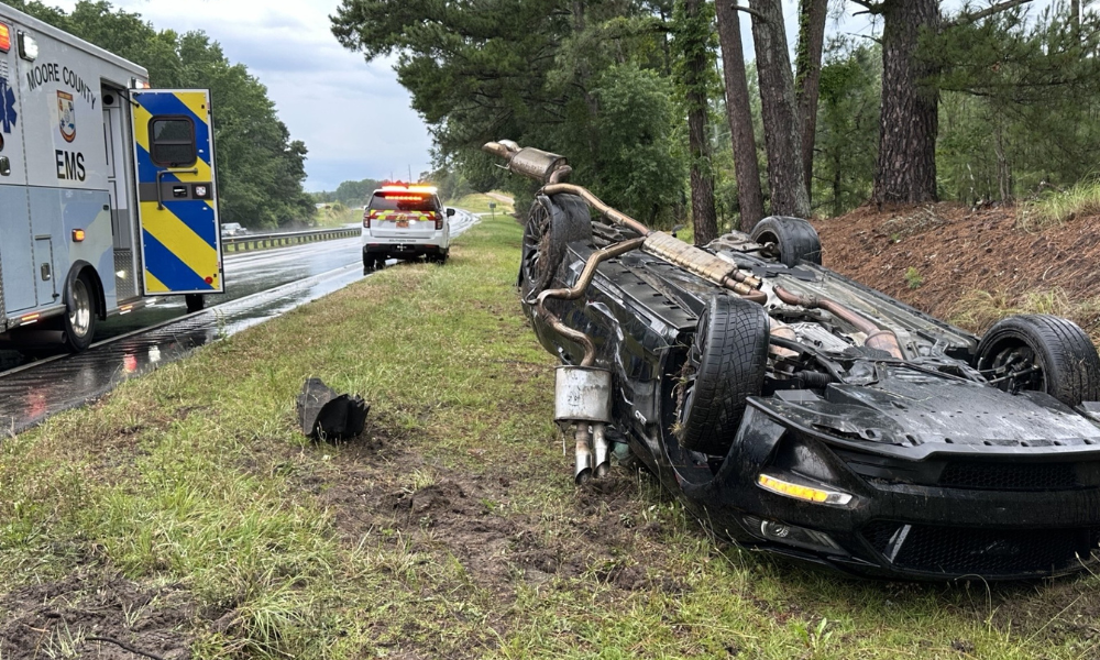 Driver uninjured after Mustang flips during Southern Pines storm