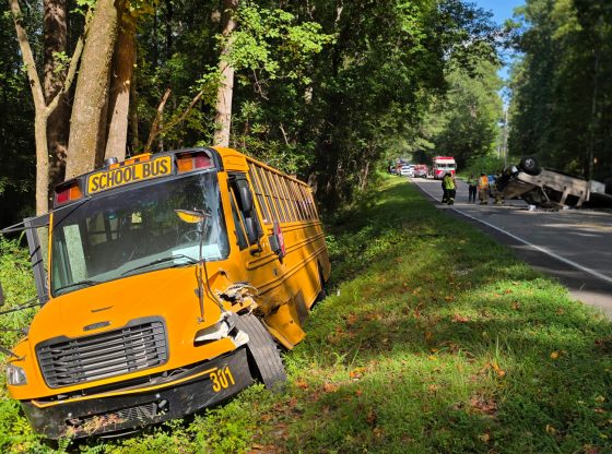 School bus and truck collide, shut down road for hours