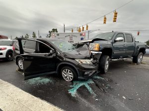 Passenger trapped, rescued after crash at busy Southern Pines intersection