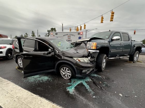 Passenger trapped, rescued after crash at busy Southern Pines intersection