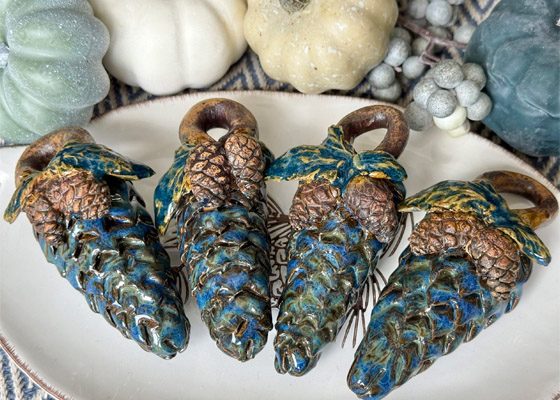 Pottery pinecones to be hidden along Moore trails this fall