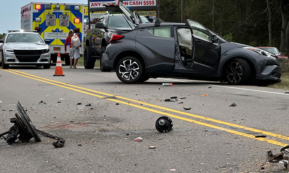 Wreck rips trailer axles off, leaves construction debris on roadway
