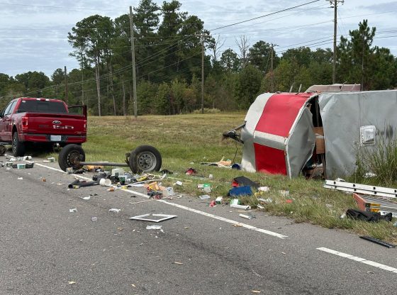 Wreck rips trailer axles off, leaves construction debris on road