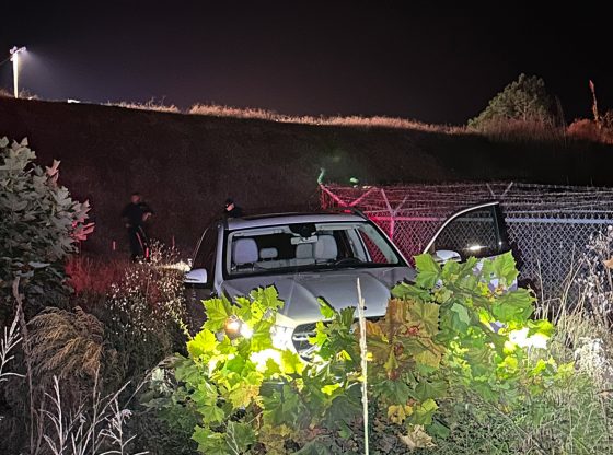 Dad charged after car with child inside rolls down hill