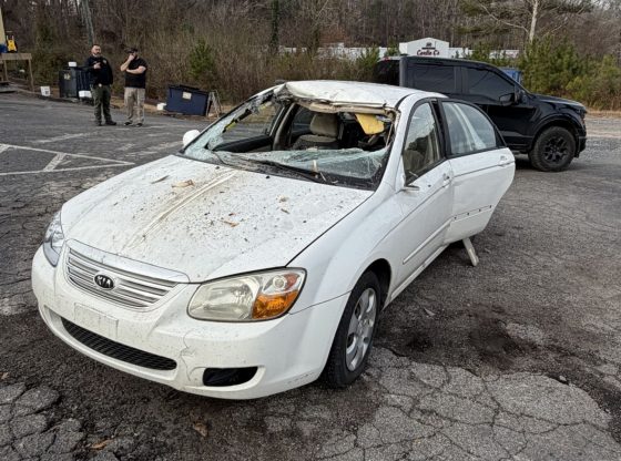 Driver injured after car strikes log truck in Robbins