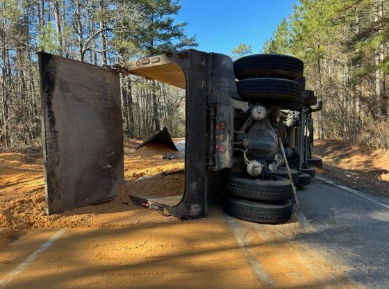 Pinebluff road closes after dump truck overturns