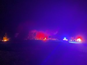 Crews stop fire from reaching truck, barn in Eagle Springs