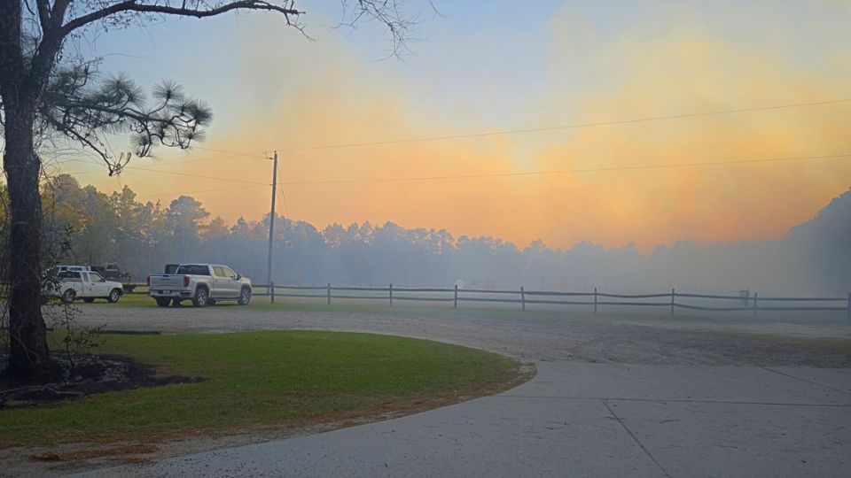 Roads closed as crews battle large outdoor fire in Pinehurst
