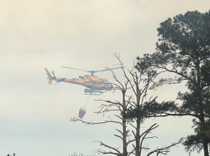 Multiple departments battle intense forest fire in Vass