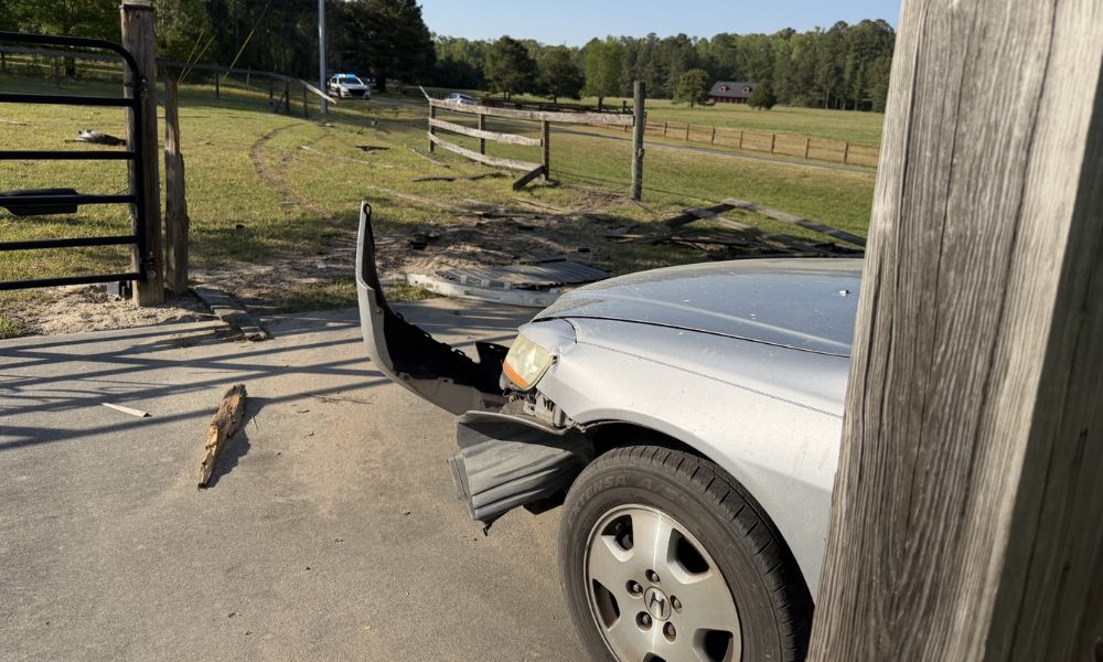 Car crashes through fence near Vass