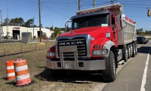 Drivers uninjured after Mack truck and Mazda collide at West End intersection