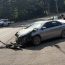 Car pushed into roadway, struck by semi