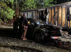 Vehicle fire spreads to home in West End