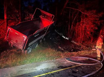 Smartphone crash activation alerts 911 of dump truck crash, fire