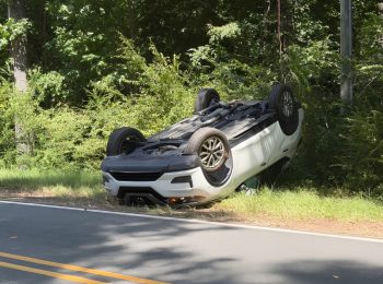 Car lands on roof after rollover crash in Cameron