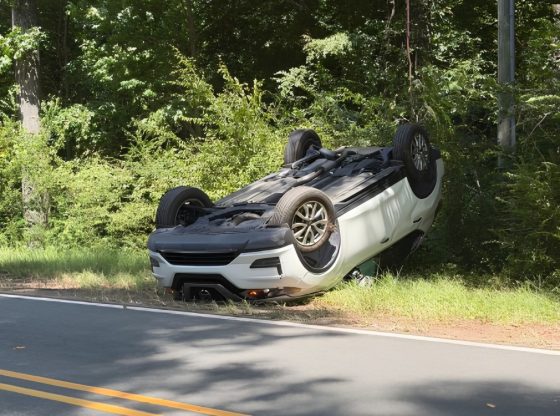 Car lands on roof after rollover crash in Cameron