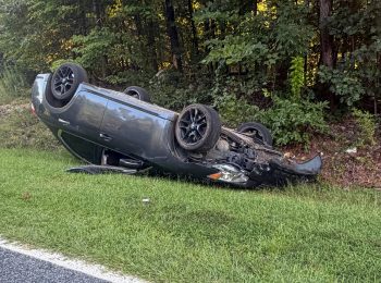 Car overturns while avoiding a deer