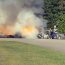 Car catches fire after striking school bus
